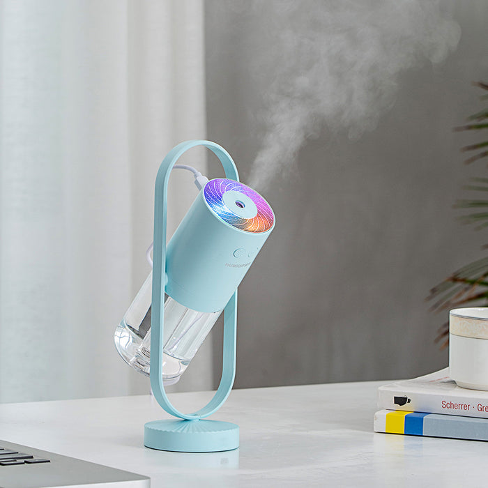 Night Mist Projector on a nightstand in a dark room