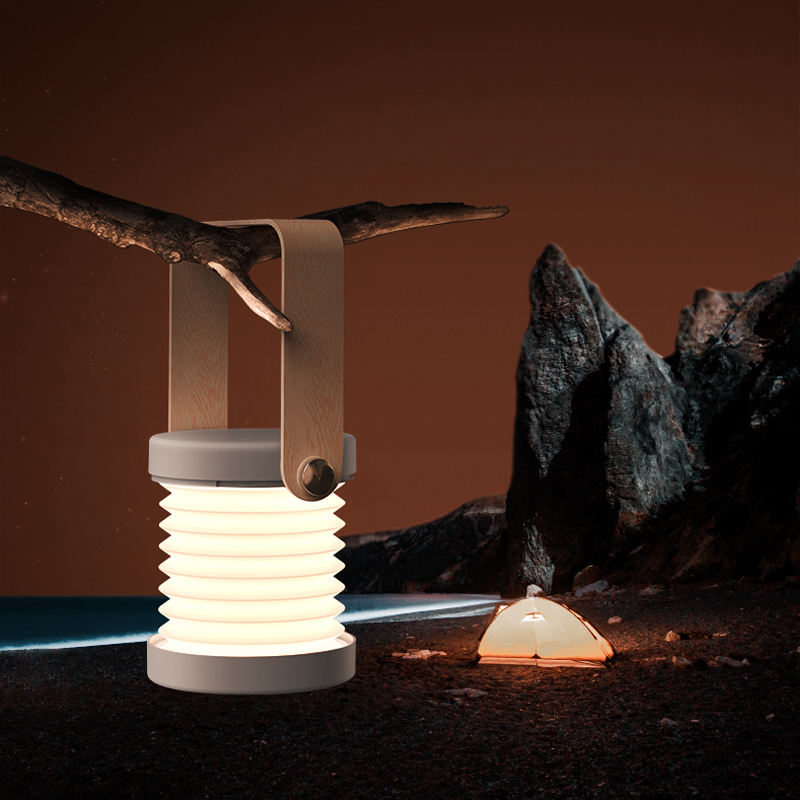 Folding Lantern glowing on a table at night