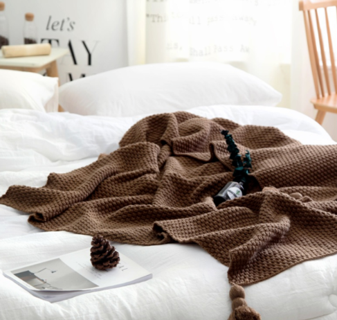Knit throw blanket with tassels