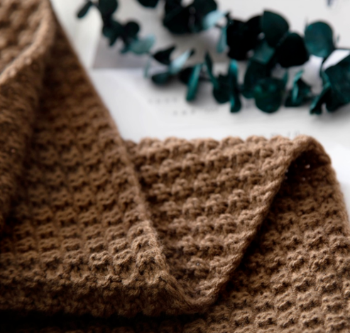 Textured knit throw with raised bobbles