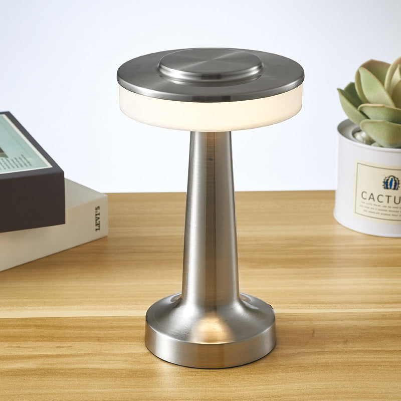 Cordless Table Lamp in silver on a wooden table
