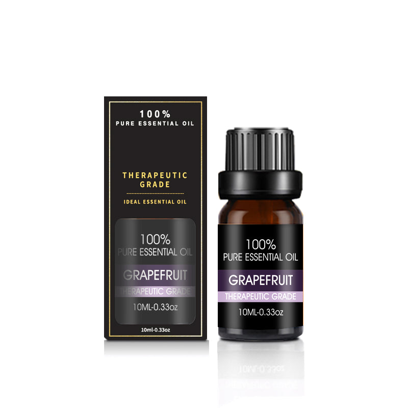 Essential oil for aromatherapy diffusers, bottle standing on a dark surface