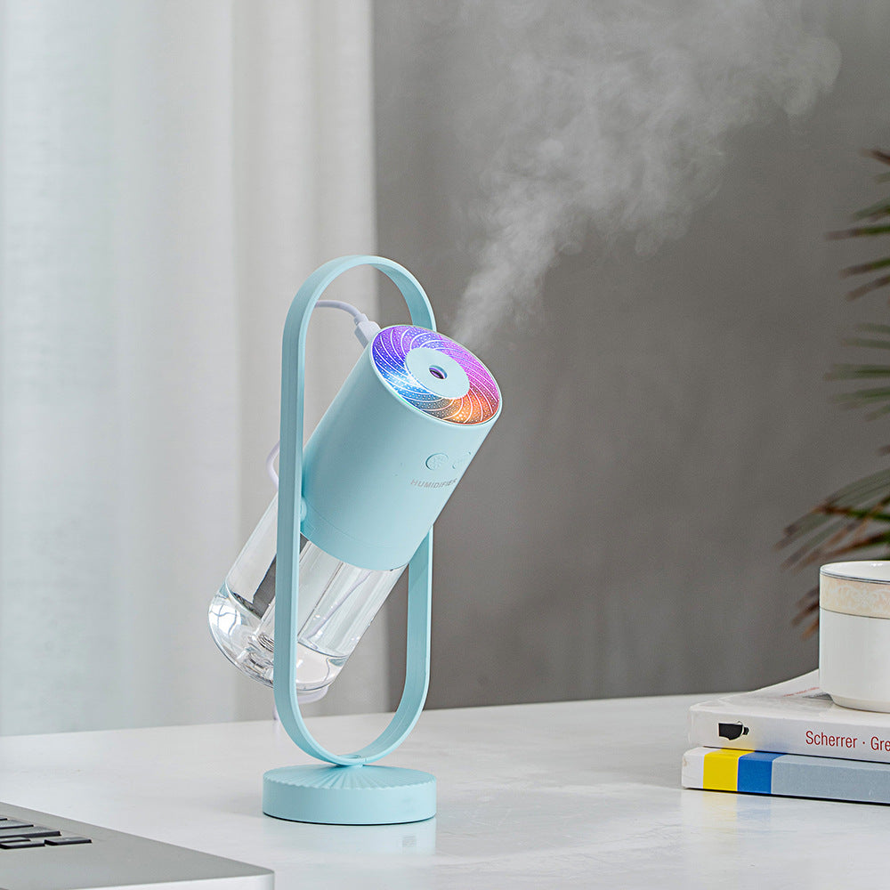 Night Mist Projector on a nightstand in a dark room