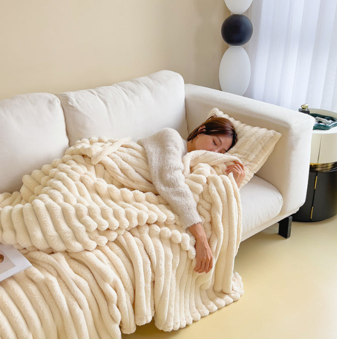 Bubble Plush Throw in milky white on a white sofa