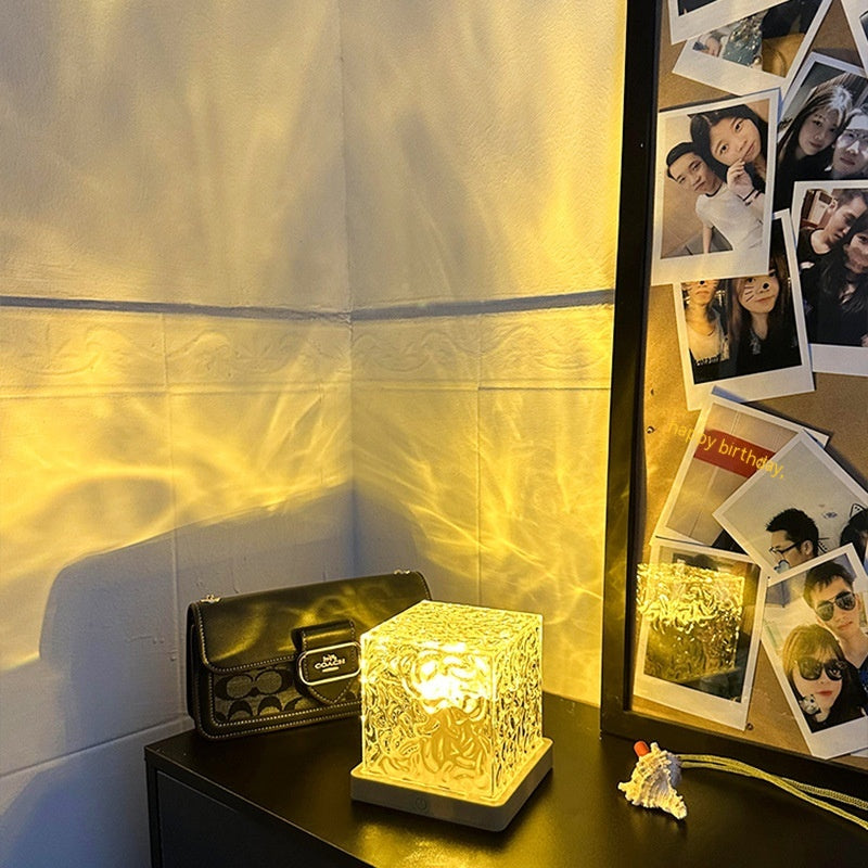 Water ripple light pattern across a bedroom ceiling