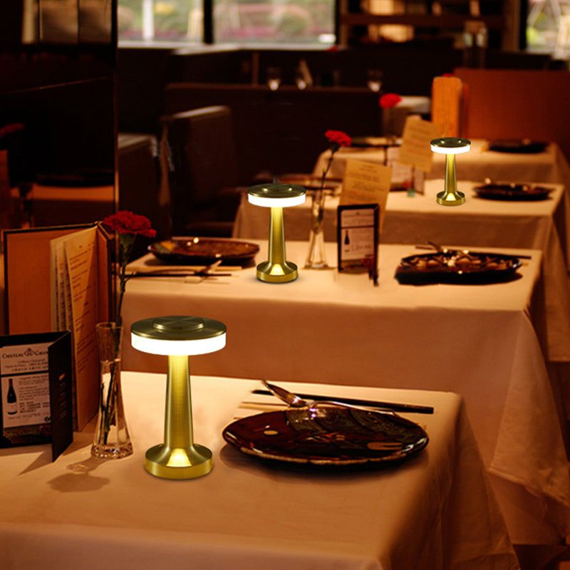 Cordless table lamps lighting restaurant tables in the evening