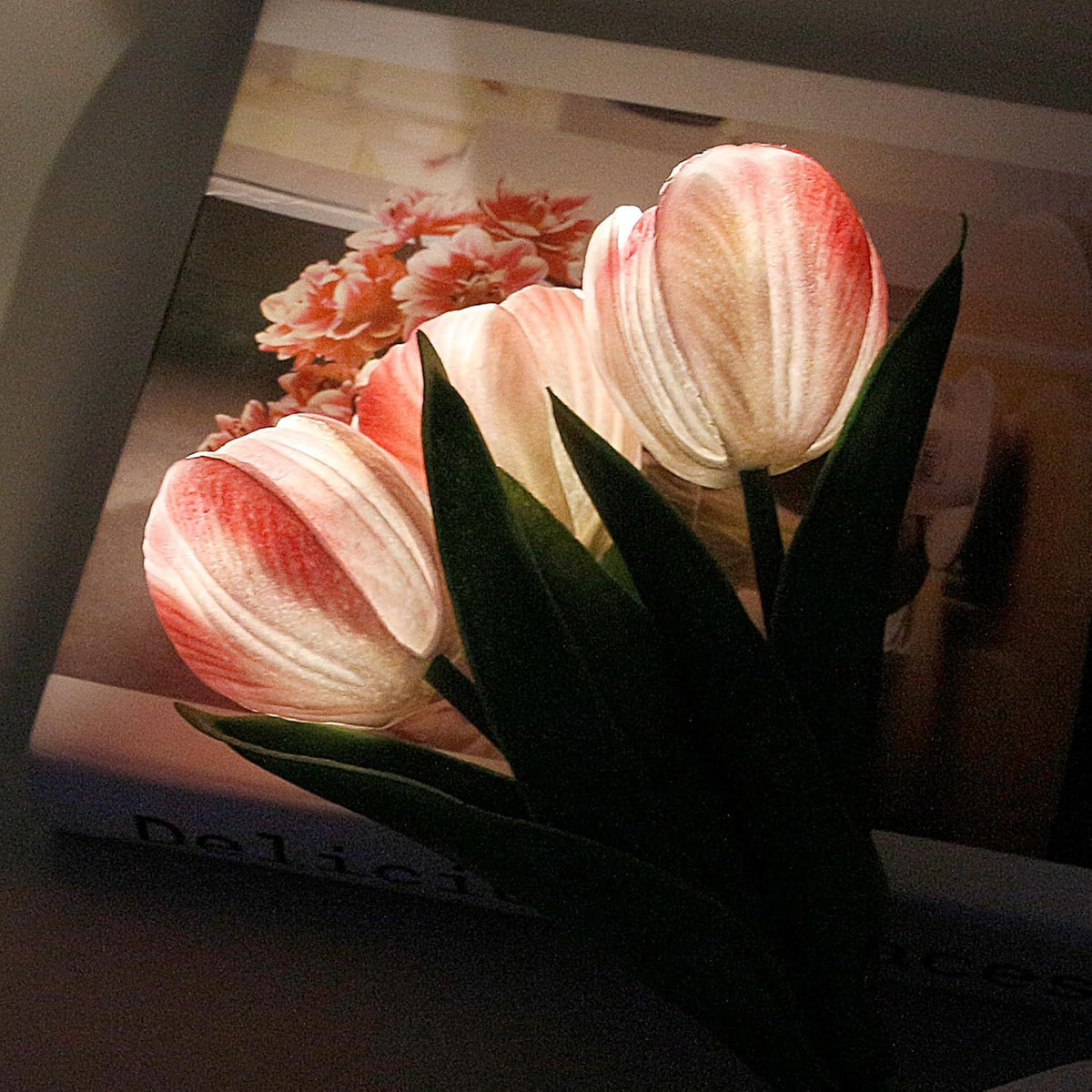 Close view of the pink tulip lamp, lit