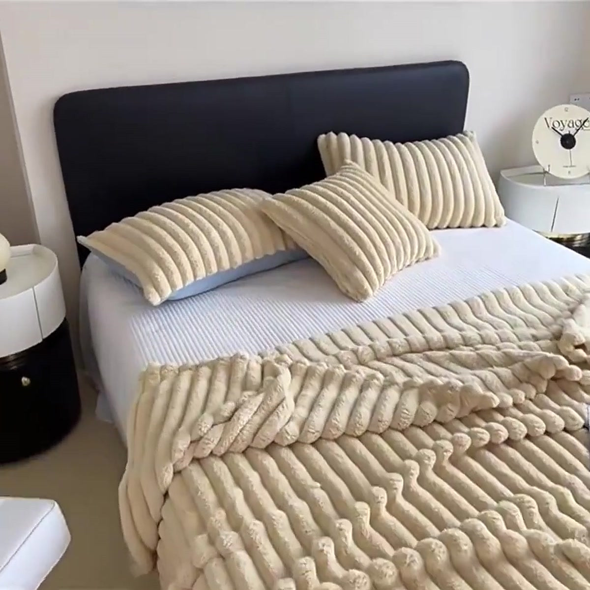 Bubble Plush Throw in khaki on a bed