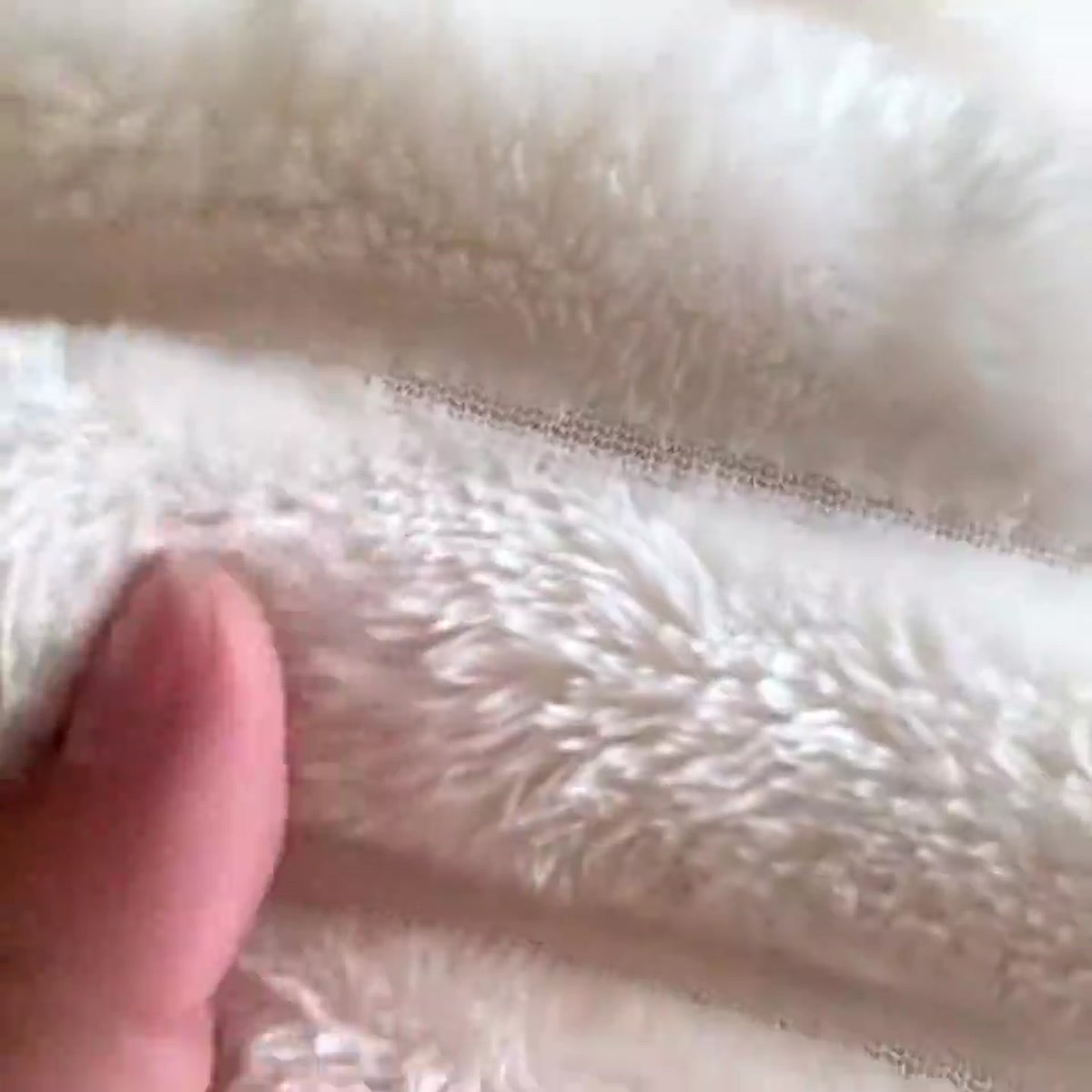 The soft plush reverse side of the throw