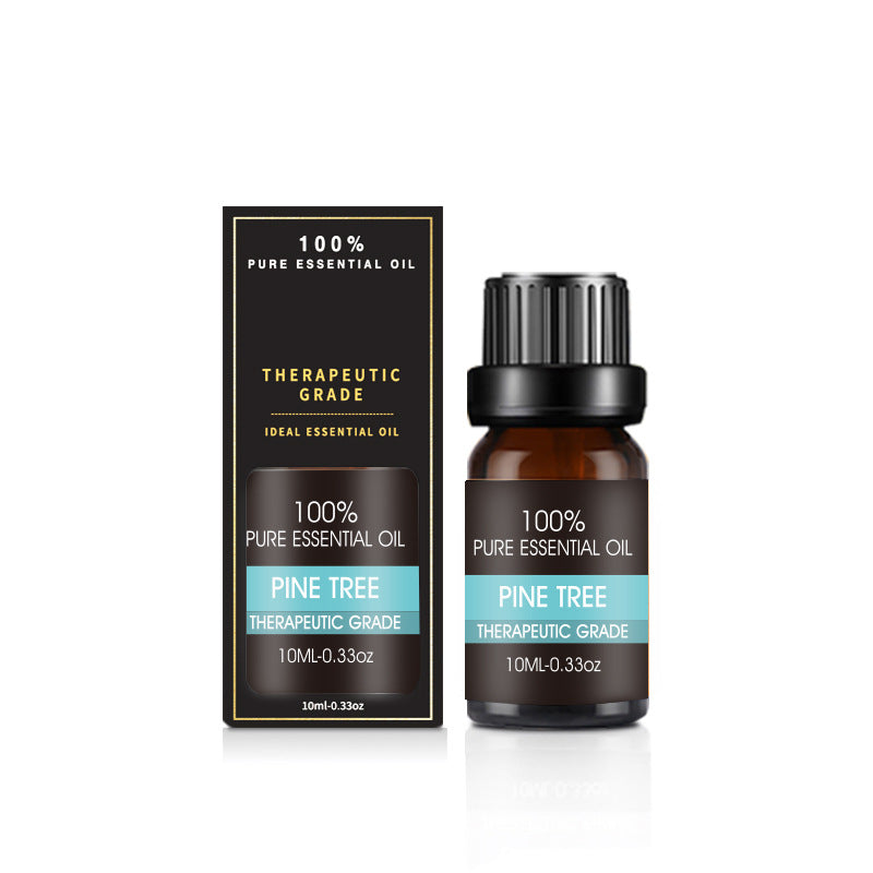 Essential oil bottle beside a cool mist diffuser on a bedside table