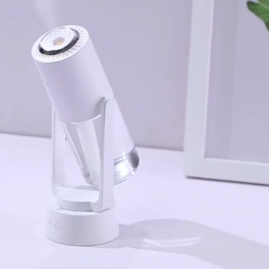 Night Mist Projector in white on a desk