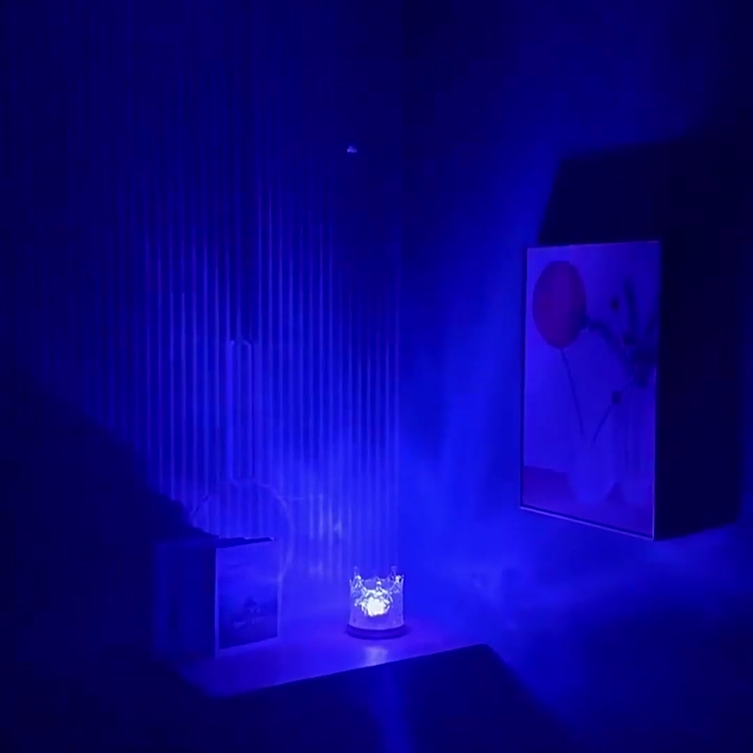 Water Ripple Lamp Crown casting blue water light across a dark wall