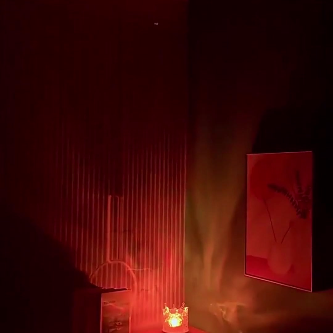 Water Ripple Lamp Crown casting warm red water light across a dark wall